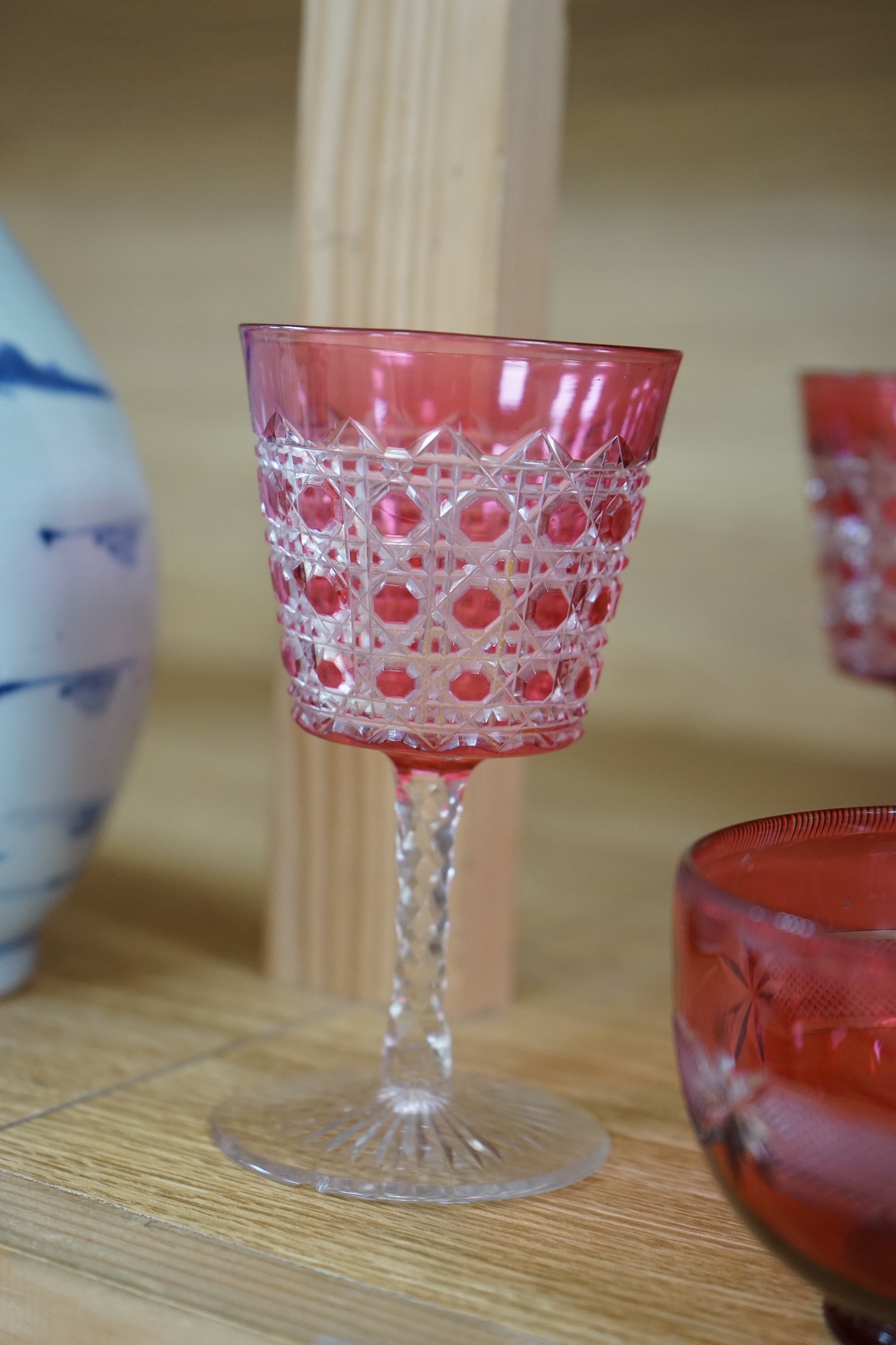 Two cranberry glass liqueur decanters and a collection of various glasses and a bowl, decanters 25cm high. Condition - good